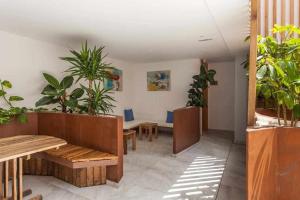 a living room filled with furniture and a table at Hotel Vacanzy Urban Boutique Adults Only in Corralejo
