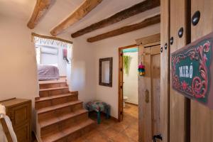 a room with stairs leading up to a staircase at Atelier 88 Boutique B&B in Alcalá la Real