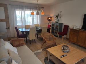 a living room with a couch and a table at La Casa OM in Almorox