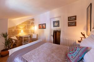 a bedroom with a large bed in a room at Atelier 88 in Alcalá la Real