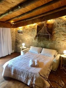 a bedroom with a bed with two towels on it at Quinta dos Carvalhos The Wine House Farm in Center of Lamego - Capital of the Douro in Lamego