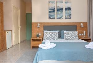 Postel nebo postele na pokoji v ubytování Theano Hotel