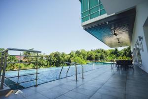 a view of a swimming pool from a building at Serene Heights by Evernent in Miri