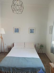 Posteľ alebo postele v izbe v ubytovaní Όμορφο διαμέρισμα στο κέντρο της πόλης