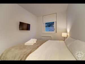 Tempat tidur dalam kamar di SALANA de Alma de Nieve