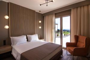 Postel nebo postele na pokoji v ubytování Villas Mandalos