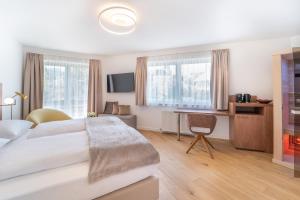 Un pat sau paturi într-o cameră la das mondsee