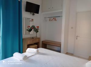 Postel nebo postele na pokoji v ubytování KELLY APARTMENTS