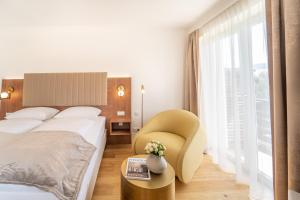 Un pat sau paturi într-o cameră la das mondsee