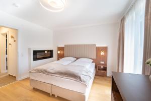 Un pat sau paturi într-o cameră la das mondsee