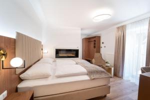 Un pat sau paturi într-o cameră la das mondsee
