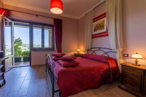 Postel nebo postele na pokoji v ubytování B&B FONTERONCONE di KRYVUTA OKSANA