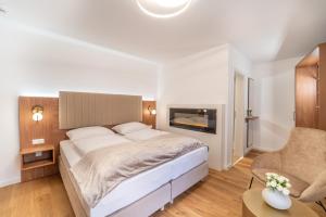 Un pat sau paturi într-o cameră la das mondsee
