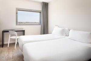 Posteľ alebo postele v izbe v ubytovaní B&B HOTEL Albacete