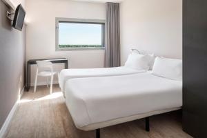 Posteľ alebo postele v izbe v ubytovaní B&B HOTEL Albacete