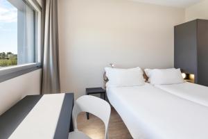 Posteľ alebo postele v izbe v ubytovaní B&B HOTEL Albacete
