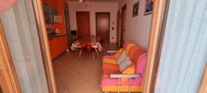 a view of a living room with a couch and a table at Casa Marco in Praia a Mare