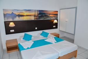 Postel nebo postele na pokoji v ubytování Blue Nest Hotel