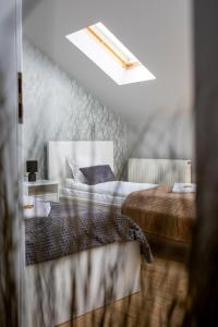 En eller flere senge i et værelse på Kalinowe Wzgórza