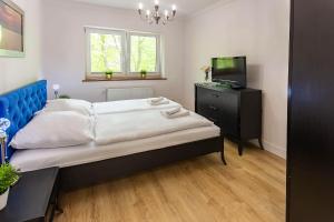 Posteľ alebo postele v izbe v ubytovaní VacationClub – Kapitańska 10 Apartament 3 + 7 fotografií