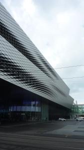 a view of a building with a large roof at easyHotel Basel City - contactless self check-in in Basel