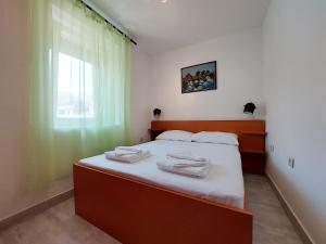 Apartments Ivan tesisinde bir odada yatak veya yataklar