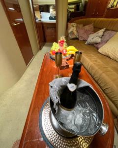a bottle of wine in a bucket on a table at Luxury Yacht Hotel in Gibraltar +25 photos