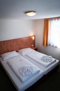 Posteľ alebo postele v izbe v ubytovaní Hotel Tauernpasshöhe