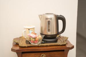 a coffee maker on top of a table at B&B da Laura e Aldo in Neive