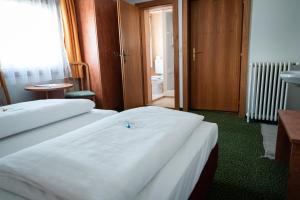 Posteľ alebo postele v izbe v ubytovaní Hotel Tauernpasshöhe