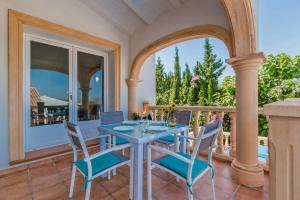 A balcony or terrace at Villa Aneto by Villa Plus