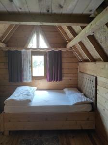 Postel nebo postele na pokoji v ubytování Birlik Yaylakent