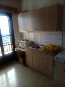 a kitchen with a sink and a stove at Panoramic view 2 in Delphi