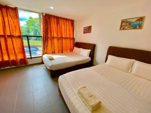 Ένα ή περισσότερα κρεβάτια σε δωμάτιο στο LS VILLAGE HOTEL
