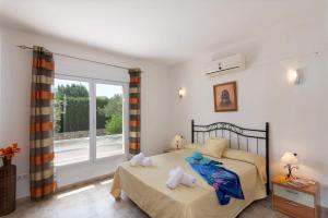 Postel nebo postele na pokoji v ubytování Villa Cabriel by Villa Plus