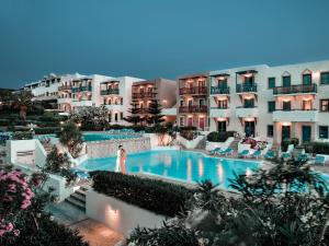 a view of a hotel with a swimming pool at Canvas by Mitsis Cretan Village in Hersonissos