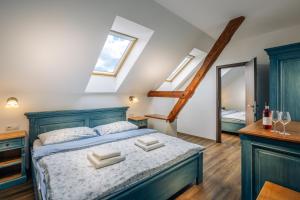 Postel nebo postele na pokoji v ubytování KNÍŽECÍ DŮM - ubytování v Lednici