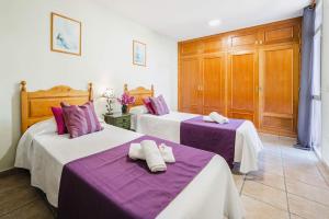 Posteľ alebo postele v izbe v ubytovaní Villa Angela Flores by Villa Plus