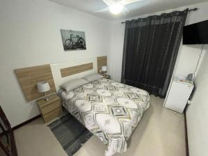 Postel nebo postele na pokoji v ubytování Vacacional Arbelo Golf