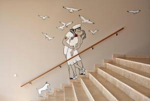 a mural of a woman walking up the stairs at AMERON Hamburg Hotel Speicherstadt in Hamburg
