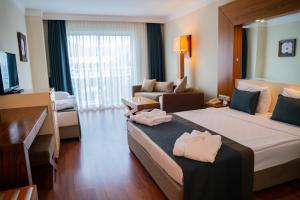 Krevet ili kreveti u jedinici u okviru objekta Meder Resort Hotel - Ultra All Inclusive