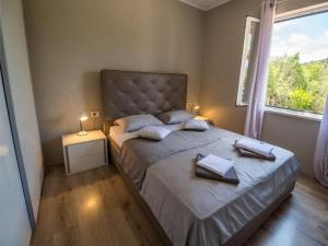 Ένα ή περισσότερα κρεβάτια σε δωμάτιο στο Apartment Noah and Matija