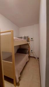 Poschodová posteľ alebo postele v izbe v ubytovaní Appartamento incantevole con ampio balcone