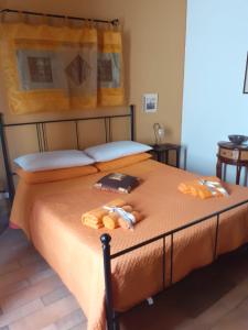 a bed with two stuffed animals on top of it at Home Casa Professa 2 in Palermo