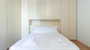 A bed or beds in a room at Italianway - Garibaldi 40