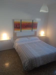 En eller flere senge i et værelse på Apartamentos turísticos en Jerez de la frontera