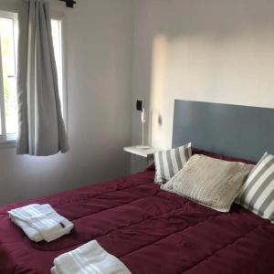 Postel nebo postele na pokoji v ubytování Cabañas El Chaja Tandil + 15 fotografií