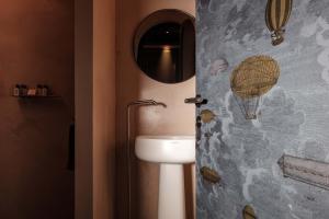 a bathroom with a white toilet and a mirror at Rosselli AX Privilege in Valletta