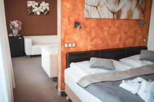 Voodi või voodid majutusasutuse Wellness hotel Lucia toas