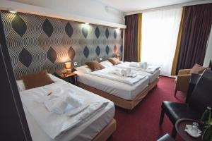 Кровать или кровати в номере Hotel Lucia